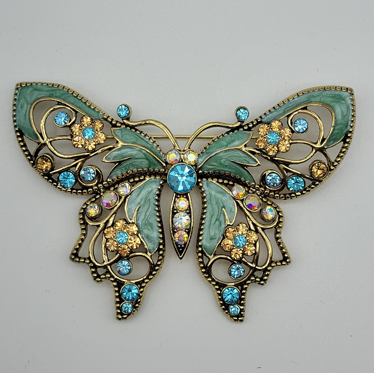 Vintage Nina Ricci Avon Brooch with Aqua, Pink, and Blue Rhinestones